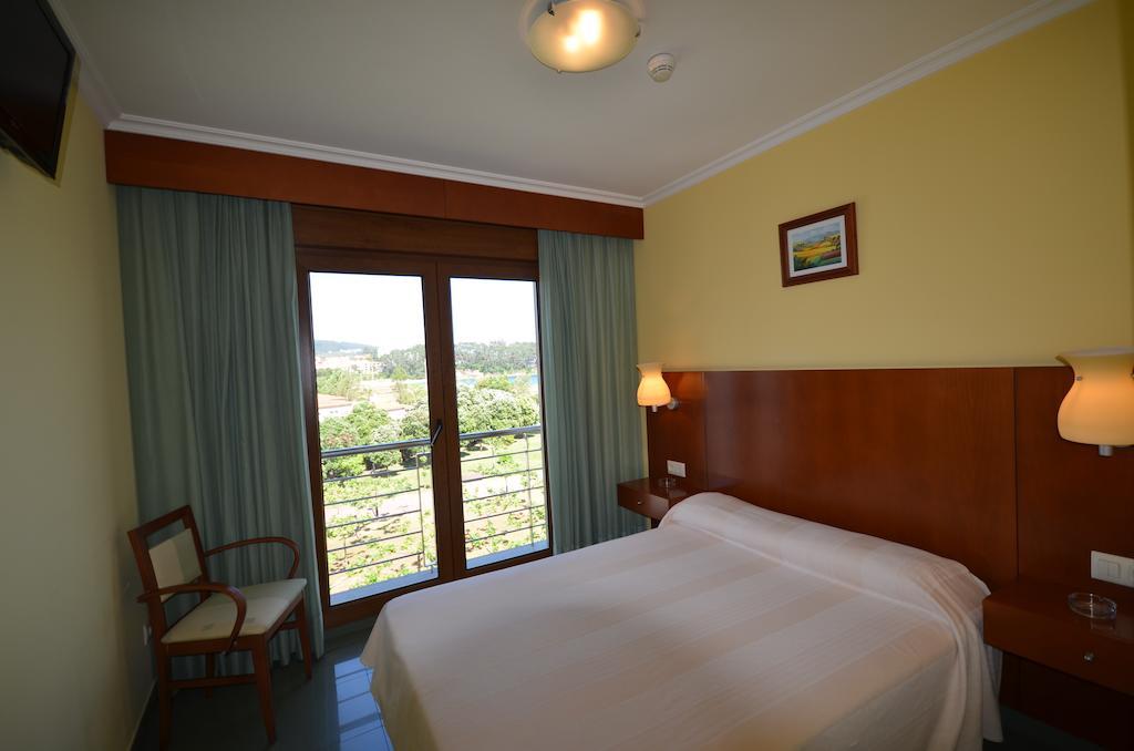 Hotel Maracaibo Portonovo Habitación foto